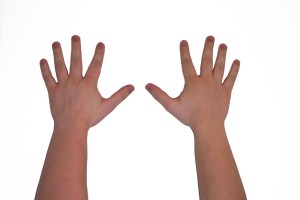 A child's hands with fingers spread out (counting to 10)